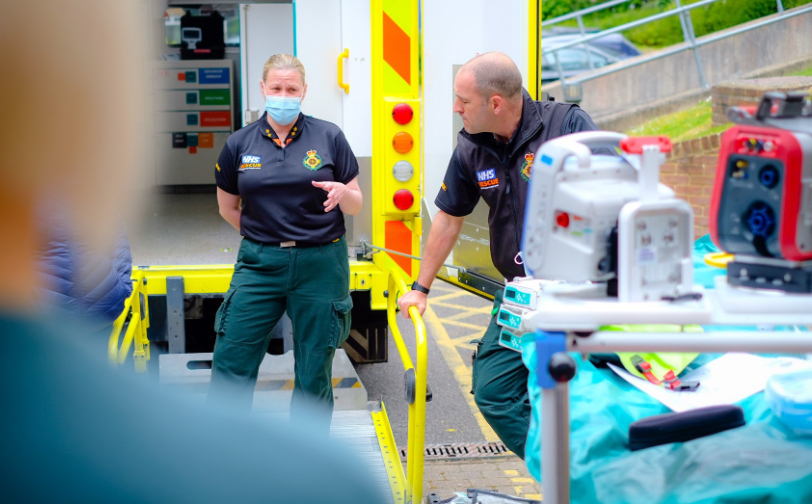 Ambulance with Transfer Service team members